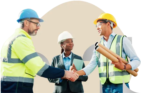 Construction workers and supervisor in safety gear exchanging handshakes at a worksite