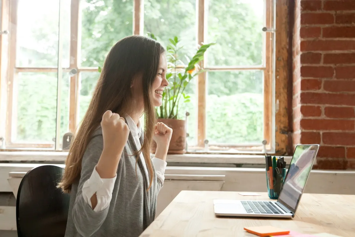 Woman expresses excitement having achieved her Change Management Certification