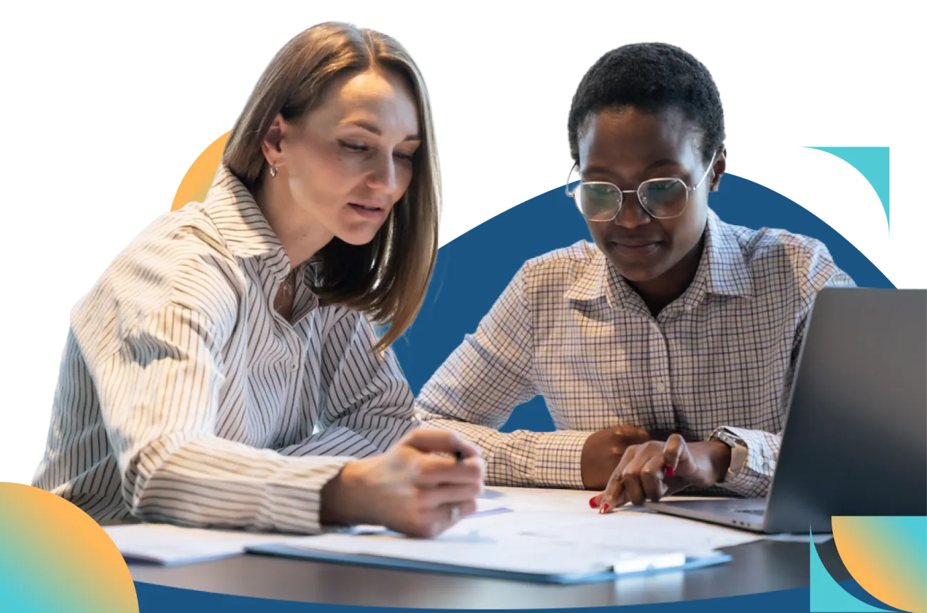Two office workers viewing a screen