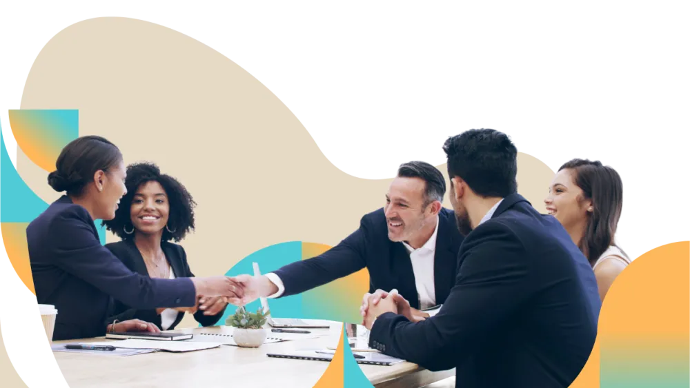 Diverse business team engaged in animated discussion around circular conference table