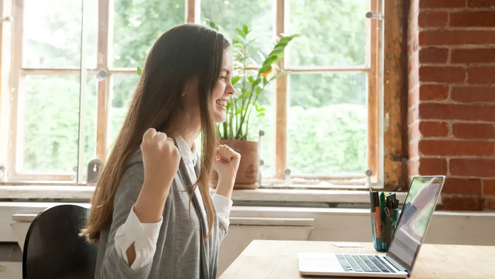 Woman expresses excitement having achieved her Change Management Certification