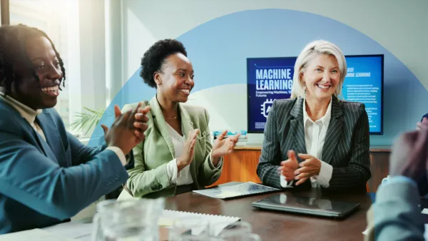 Three business professionals collaborating at a table, reviewing documents and discussing strategy.